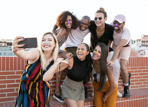 Seven peoples taking selfie with wearing Nöz sunblock on nose in colorful variation